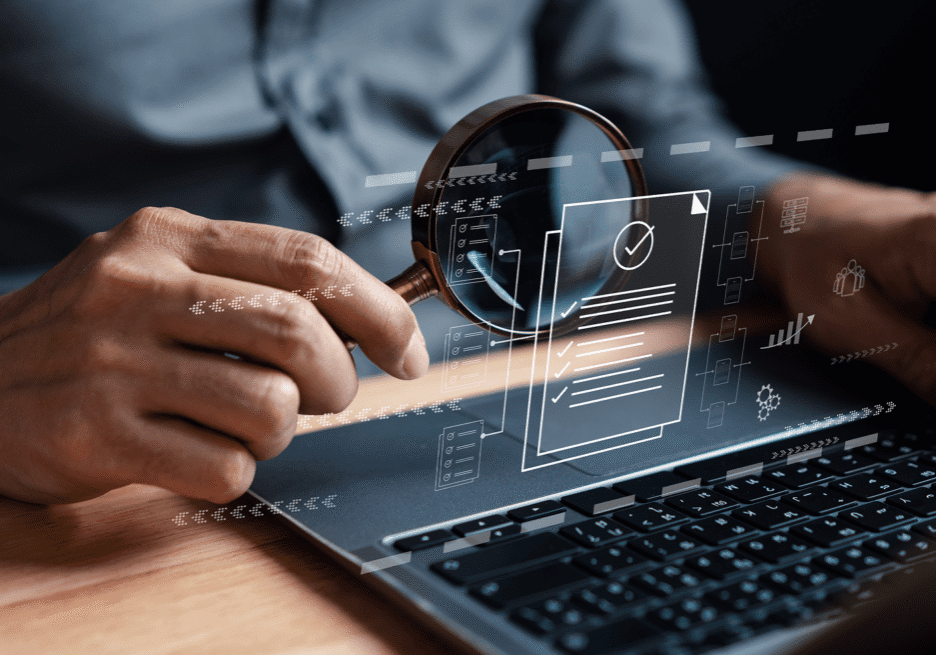 A person interacts with a digital interface on a laptop, showing futuristic data visuals.